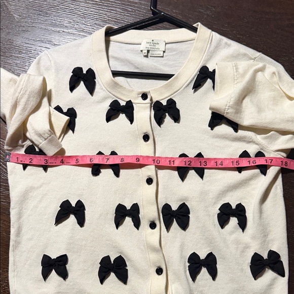 Kate Spade Ruthie Bow Cardigan in cream with black bows. - Picture 6 of 8